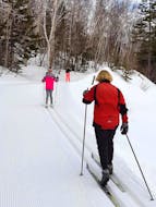 Skiers on a North Highlands Nordic ski club trail.