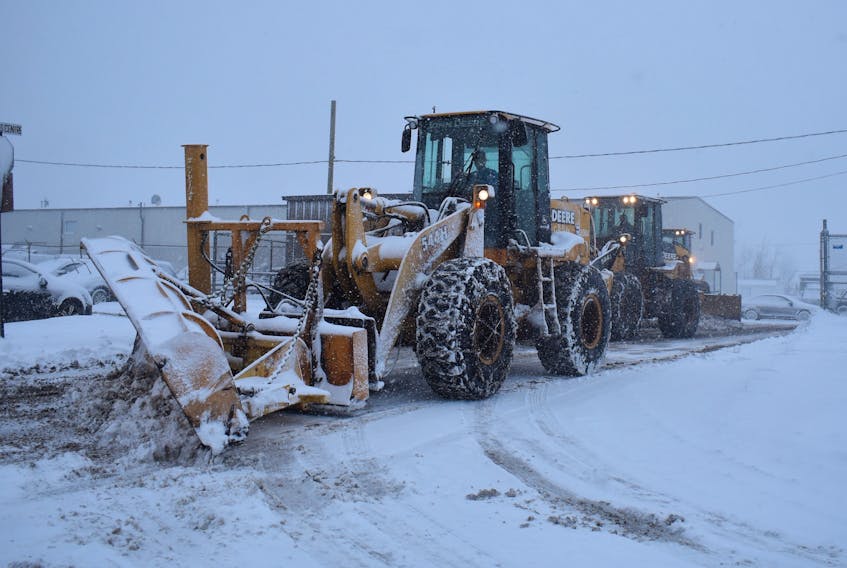 A front-end loader with a modified snowplow leads a convoy of CBRM snow removal equipment out of the public works department’s Inverness Street depot in Sydney early Wednesday afternoon. These vehicles headed to nearby Victoria Road where they dispersed in different directions and joined scores of other trucks and plows in taking on the second major snowstorm to hit the CBRM this week.