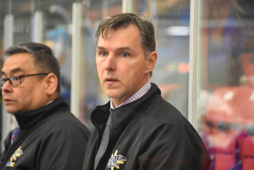 Team British Columbia male hockey team head coach Dwayne Roloson is shown on the bench on Tuesday at the Membertou Sport and Wellness Centre during their game against Team Atlantic.