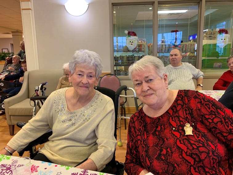 Sarah Ann Fahey, left, shares a moment with her sister and fellow Harbourstone Enhanced Care resident Margaret Ann Cann in this photo taken before social distancing measures went into place. Fahey was one of three residents of the home to test positive for COVID-19. However, she has recovered after being mostly asymptomatic.