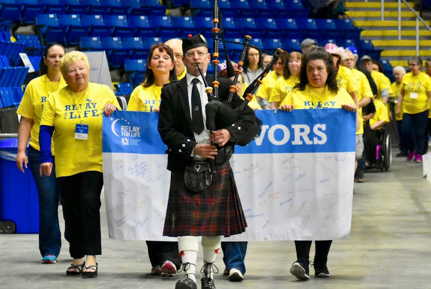 Piper Courtney MacPherson leads the Survivors Victory Lap around Centre 200 on Friday night at Sydney’s 16th annual Relay For Life.