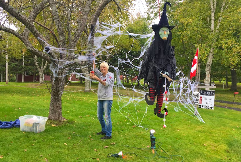 Barb Chiasson, owner of Barb's House of Art tattoo parlour, took some time to work on her Halloween decorations on Oct. 7, hoping to get it finished to surprise her husband when he got home.