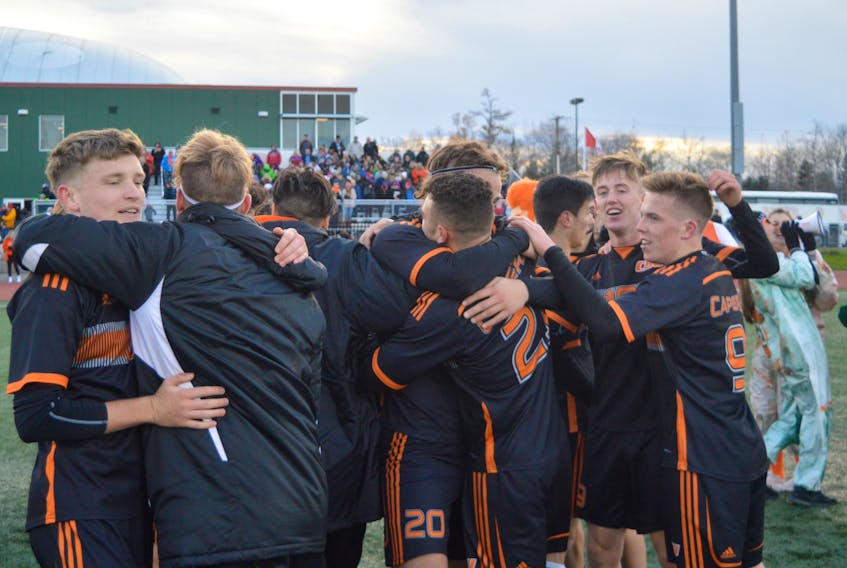 CBU Capers players enjoy the moment on Sunday after winning the AUS mens soccer championship. Thursday in Kamloops, they will open play in the national championship tournament. DAVID JALA/CAPE BRETON POST