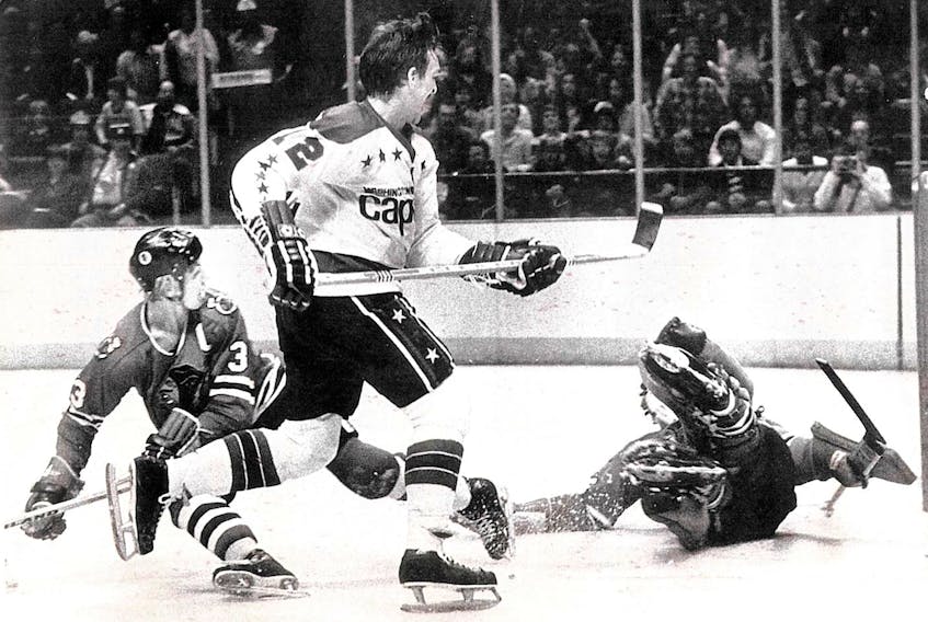 Nelson Burton scores on Chicago Blackhawks goalie Tony Esposito as defenceman Keith Magnuson falls to the ice in this Nov. 2, 1977 photo. Submitted photo/Roger Burns