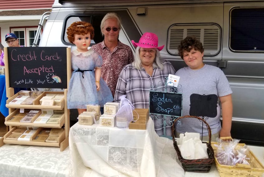 Sodan Soaps etc. was set up on Charlotte Street in Sydney for the street festival last week. From left, Rich Clavey, his wife and owner of Sodan Soaps etc. Maggie MacDonald and their grandson Jacob Gray. Products for sale included lip balms, bath bombs and plenty of soaps.