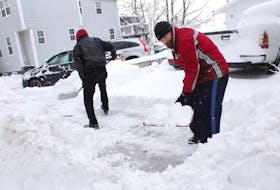 Joseph Ash, left, and his cousin Warren Powell were busy clearing a sidewalk in front of a north end Sydney business this week. The pair spent a good portion of their day on Thursday shovelling as a favour for a friend.