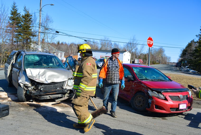 Members of the Reserve Mines Volunteer Fire Department assisting at a two-vehicle accident at the Gardiner Road Intersection on Seaside Drive on March 4. Members of the Cape Breton Regional Police Service say there were four accidents at this location the past two weeks.