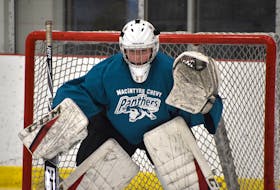 MacIntyre Chevy Panthers goaltender Julia Carroll keeps her eye on the puck at team practice Thursday at the Membertou Sport and Wellness Centre. The Panthers open their best-of-five provincial female midget ‘AAA’ hockey championship series on Saturday in New Glasgow against the Northern Subway Selects.