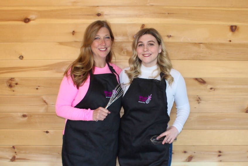 From left, Carol Drohan and her daughter Nicole stand in their Sydney home where they operate Whisk It Up Baking Kits — a business launched during the stay at home orders to stop the spread of COVID-19 in Nova Scotia. The company gives people a recipe and all the ingredients to make classic baked goods.