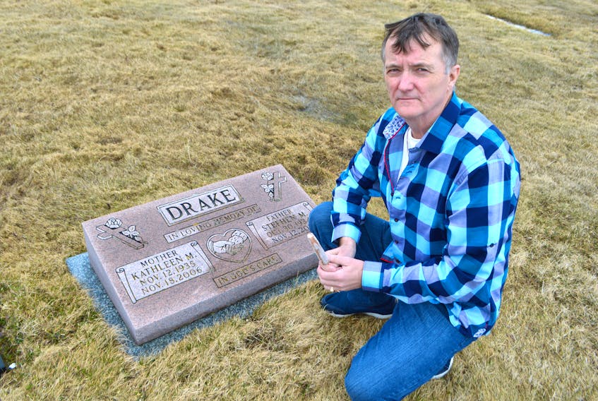 Steve Drake Jr. of New Waterford spends time at the gravesite of his father, the late Steve Drake Sr., at St. Agnes Cemetery in New Waterford, with a fudge stick. Drake Jr. said in 2004 he made a promise to his father — over fudge sticks — to see his father’s severely damaged coal miner’s lungs autopsied for workers’ compensation reasons.