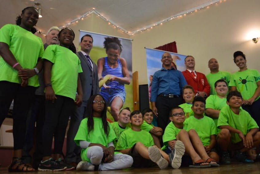 Participants in the Community United for Black Education program, elected representatives and members of community halls in Cape Breton posed for a photo at Menelik Hall in Whitney Pier on Wednesday morning following a provincial funding announcement. Funding for 14 projects was announced.