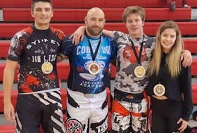 Four Cape Breton fighters captured medals at the Maritime Open Brazilian Jiu-Jitsu tournament, held Sept. 28  in New Glasgow. Tyler Jennings won gold in the 161-175-pound beginners division, while Mark McLanders picked up the gold medal in the 161-175-pound intermediate class. Hailey Boutilier won silver in the beginner open women's weight division, and Jimmy Hall took home the bonze medal in the 215-plus advanced division. From left, Jennings, Hall, McLanders and Boutilier. PHOTO SUBMITTED/JIMMY HALL