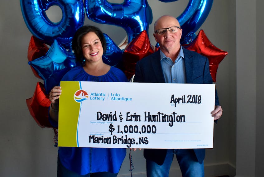 Erin and David Huntington pose with an oversized Atlantic Lottery cheque for $1 million. The Marion Bridge couple claimed the prize during an official ceremony on Tuesday at the Membertou Trade and Convention Centre after their ticket number matched the 10-digit guaranteed prize Lotto 6/49 draw on March 28.