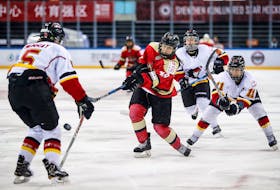 Baddeck’s Jessica Wong, middle, fires the puck in a game against the Calgary Inferno during the 2017-18 season. Wong came out of retirement to play for the Kunlun Red Star, one of two expansion teams from China in the Canadian Women’s Hockey League.