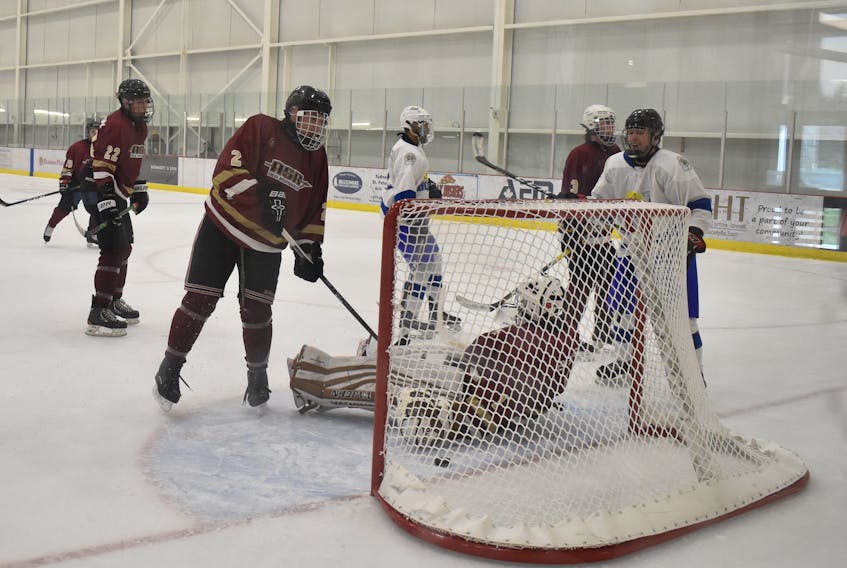 Brady Marche, far right, celebrates Team Atlantic’s fifth goal during the first period of his team’s game against Team New Brunswick on Thursday morning in Membertou. New Brunswick players shown, from left, include Dontae Augustine, Keith Dennis and William Cassell. Atlantic won the game, 6-3.