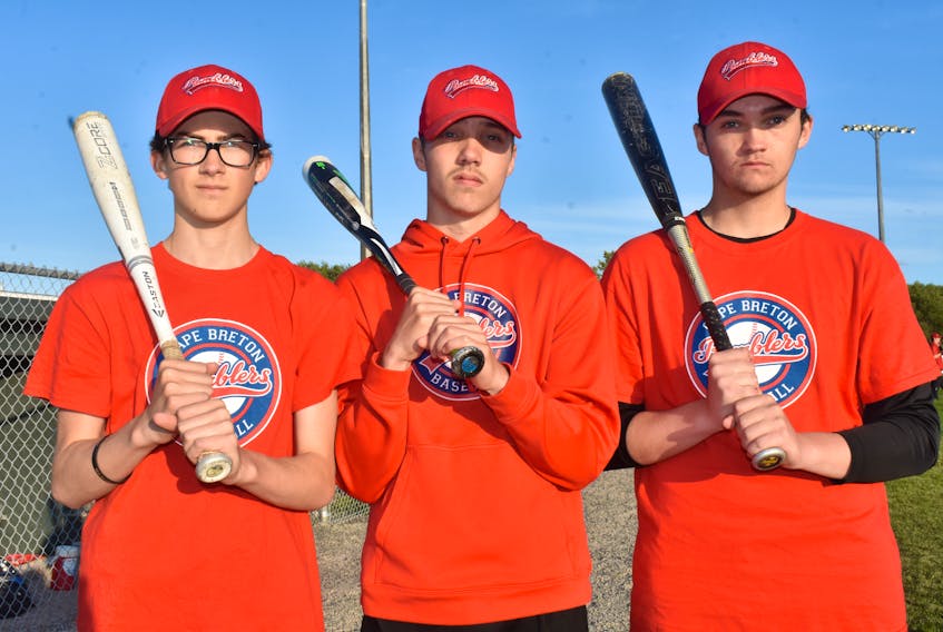From left, left-fielder Keigan Landry of Howie Centre, third baseman/pitcher Jarrett Hicks and pitcher/first baseman Parker Hanrahan, both of Glace Bay, are the three returning players with the Cape Breton Ramblers team that competed at last year’s nationals in Edmonton. The Ramblers will host this year’s national tournament starting Saturday in Sydney Mines.