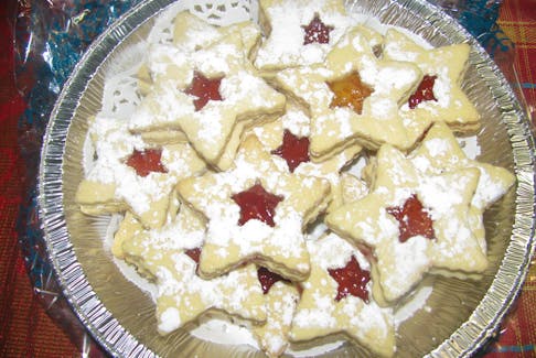 Strawberry Linzer Christmas Cookies are pretty and delicious.