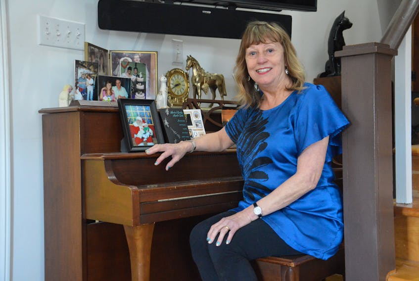 Susan Gallop sits at the piano in the living room of her home in Balls Creek on Wednesday. The founder and owner of Cape Breton School of the Arts is one of the 2018 inductees into the Cape Breton Business and Philanthropy Hall of Fame.