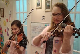 Julia Buczkowska, left, and Jolanta Cebula at their home in Westmount performing “Majowa Piosenka” (May Song) during the recent online Cape Breton Polish Ceilidh.