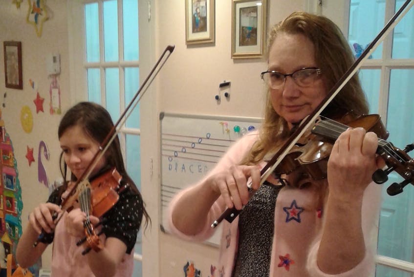 Julia Buczkowska, left, and Jolanta Cebula at their home in Westmount performing “Majowa Piosenka” (May Song) during the recent online Cape Breton Polish Ceilidh.