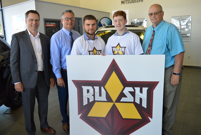 The name and logo for the Nova Scotia Eastlink Major Midget Hockey League’s Sydney Mitsubishi Rush was unveiled on Thursday at Sydney Mitsubishi. From left, Mackie MacLeod of the team’s alumni association, Sydney Mitsubishi owner Mike DeGiobbi, players Kody Groves and Nick Mahar and team president Walter Rutherford.