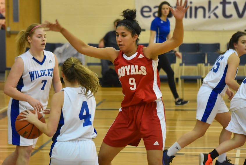Nalini Maharaj of the Riverview Royals, right, guards Amy Lynch of the Sydney Academy Wildcats, middle, as Alesha Hoban of the Wildcats heads up the court during Cape Breton High School Basketball League play Monday at Sydney Academy gym. Maharaj scored 28 points in a 62-55 win.