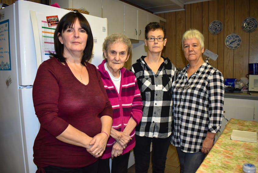 From left, Evelyn Burke, Evangeline Wareham, Sarah Morrison and Inez Lemoine stand in the kitchen at the Forchu Community Center on Dec. 10. The Framboise residents are “disgusted” they are still having problems with their Bell Aliant phone service and are worried about losing phone service during the winter. Some residents in Forchu are also affected. Nikki Sullivan/Cape Breton Post