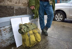 Keith, a 50-year-old homeless man who’s been staying at a Sydney shelter, stands on the sidewalk outside the Ally Centre of Cape Breton on Wednesday. Keith, who didn’t want his last name used or face shown, said people who use the Community Homeless Shelter on Townsend Street now have their belongings searched by staff.