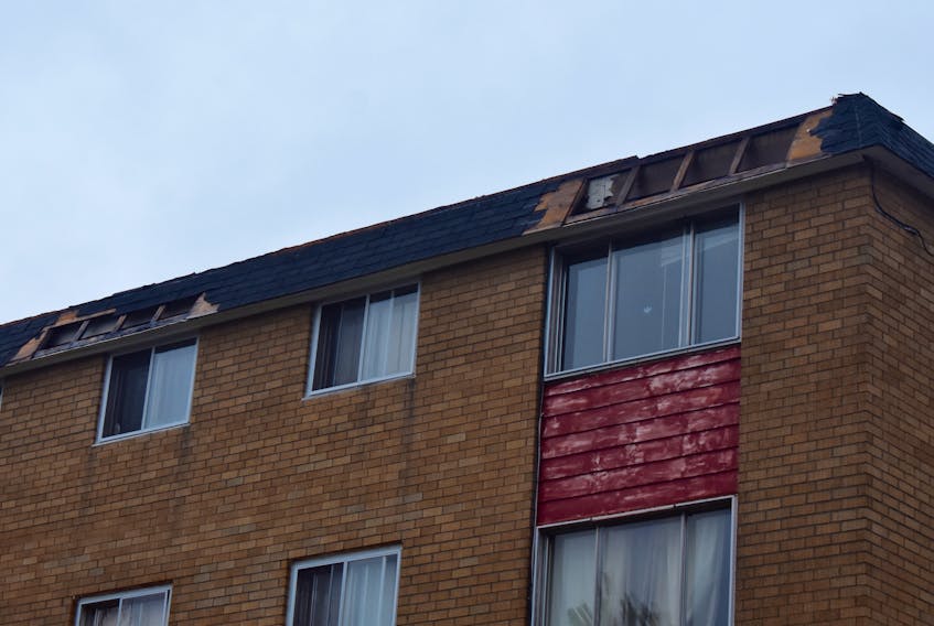 Some of the damage to an apartment complex at 297 Rotary Drive caused by Tuesday's storm. Eighteen tenants of the complex in Sydney were still displaced Wednesday, after a portion of the roof became detached.