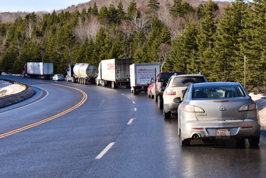Traffic was backed up for much of the day on Highway 105 near Kellys Mountain on Friday as RCMP investigated a crash involving a school bus and a trailer parked partially on the road. The bus driver was seriously injured while the 11 students onboard suffered bumps and bruises.