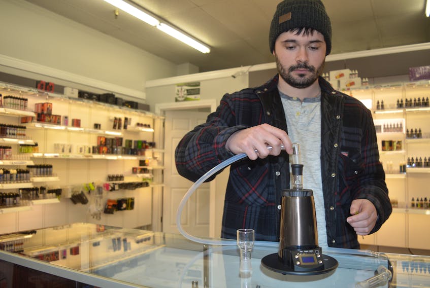 Coastal Vapor employee Dylan Muise explains how the sophisticated Arizer Extreme-Q vaporizer works at the shop he manages on Charlotte Street in Sydney. The owner of Coastal Vapor, Walter Burgess, says he’s preparing to stock up on merchandise and accessories for marijuana users as the drug will become legal this summer.