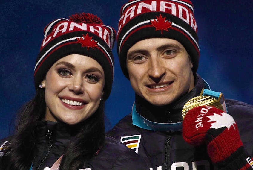 Gold medallists Tess Virtue and Scott Moir pose during their medals ceremony at the 2018 Winter Olympics in Pyeongchang, South Korea, Feb. 20. Virtue and Moir are among the retired all-star athletes hitting the road for a thank-you tour and will be in Sydney on Nov. 14.