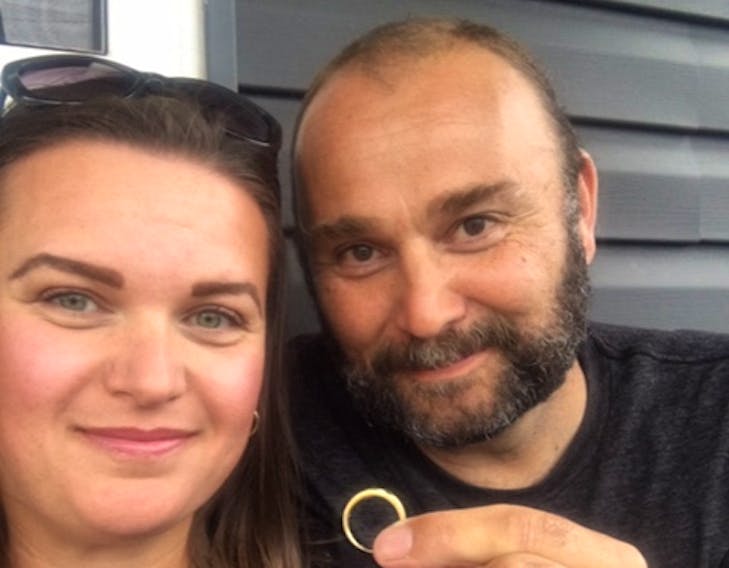Allison and Robert Melski show off the wedding ring that was lost in Bras d’Or Lake on their first wedding anniversary in 2008. The ring was found by family members on Sept. 1, and returned to the couple on the evening of their 12th anniversary.