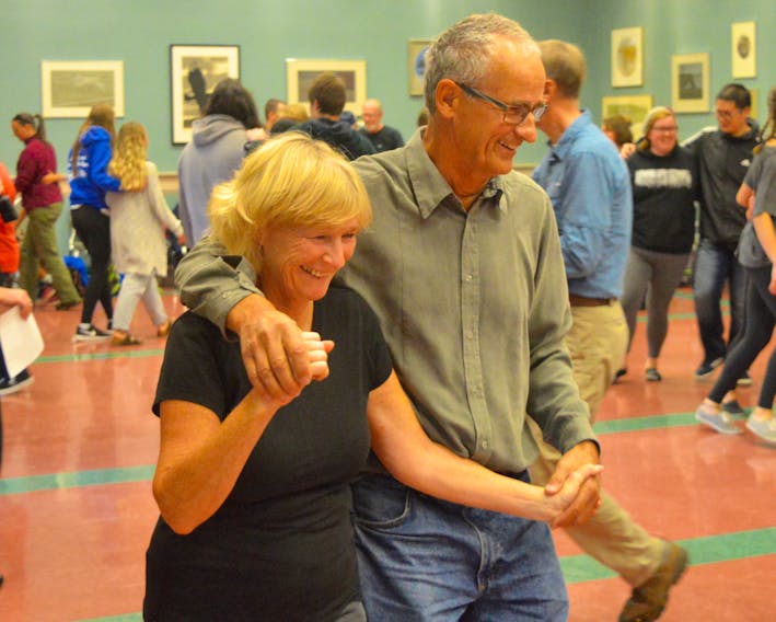 Donna and Norman Short, visiting from Manitoba, had themselves a swirling good time at the All Ages Family Square Dance at Cape Breton University. The Thursday afternoon Celtic Colours event attracted about 100 participants who spent a couple of hours dancing to the music of fiddler Howie MacDonald and guitarist Mary Beth Carty.