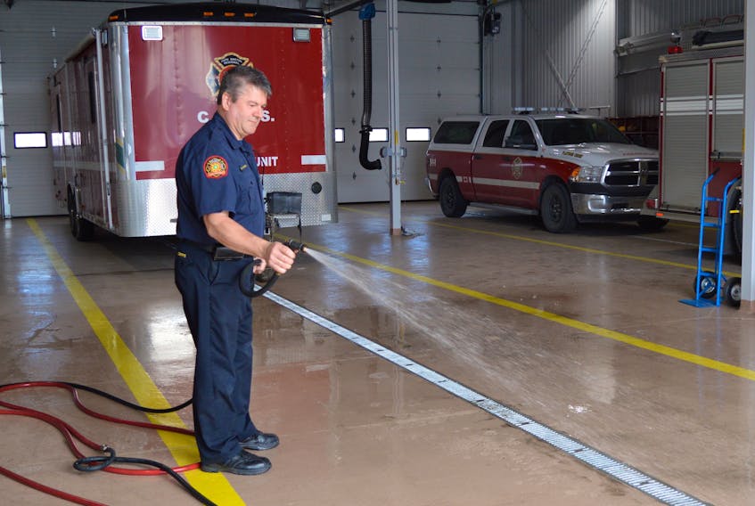 Firefighter Dougal MacAulay sprays down the floor of Sydney Station 2 during its first day of operation in 2017. Cape Breton Regional Municipality career firefighters have voted 84 per cent in favour of accepting a new eight-year contract retroactive to 2016 that will see unionized fire services personnel get a 2.75 per cent raise in each year of the contract.