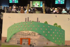 David Dingwall, president of Cape Breton University, centre, is shown at the podium at the Joan Harriss Cruise Pavilion in Sydney on Thursday. In the foreground is a conceptual drawing of the proposed Centre for Discovery and Innovation.