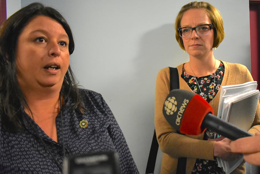Cape Breton Regional Municipality councilors Earlene MacMullin, left, and Amanda McDougall talk outside of council chambers Tuesday. Both representatives walked out of an in camera meeting that was ostensibly about the mayor’s recent trip to China and McDougall’s criticisms. Cape Breton Post Photo