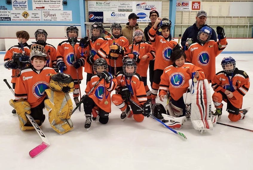 The Cape Breton County Islanders atom ‘C’ hockey team captured the Trail Riders tournament championship title with a 6-5 win over the Baddeck Bobcats at the Cabot Trail Arena in Cheticamp. The Islanders posted a 1-0-2 record in the round robin and advanced to the championship with a 3-0 win over Glace Bay in the semifinals. Front row, from left, Cody Wells, Luke MacIntosh, Seth Kaiser, Harry Sock and Chase Burke. Middle row, from left, Isaac Ward, Connor MacLean, Conall Francis, Joshua Ross, Cassius Stevens, Grazen Gould, Darren GooGoo, and Jackson MacLellan. Back Row, from left, coaches Nelson MacLean, Donnie Ross and Chris Ward. Missing from the photo was Devin Stevens, Cam Marshall, Zeddy Isaac and Donovan Toney. PHOTO SUBMITTED/JOLENE MACLELLAN.
