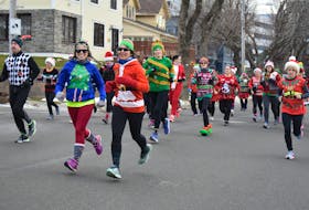 Aimee Crowe, left, and Patricia Peori at the start of the Ugly Sweater Run in Sydney last year.  The event, which raises funds and toys for Christmas for woman and children assisted through Transition House, last year raised about $1,000. The 8th annual run is taking place Sunday at 10 a.m. Cape Breton Post file photo.