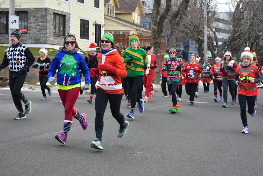 Aimee Crowe, left, and Patricia Peori at the start of the Ugly Sweater Run in Sydney last year.  The event, which raises funds and toys for Christmas for woman and children assisted through Transition House, last year raised about $1,000. The 8th annual run is taking place Sunday at 10 a.m. Cape Breton Post file photo.