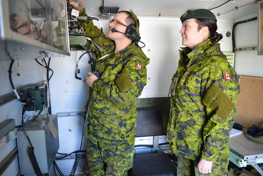 Cpl. Shaun Oram, left, of the 36 Signal Regiment at the Dr. Guglielmo Marconi Armoury in Glace Bay, works on some of the communication equipment in the command post with Master Corporal Breagh Shea. There are currently more than 265 army reservist positions open in Cape Breton, mainly entry-level positions. Although these are mainly part-time positions, they include minimal commitments, good pay, benefits and opportunities for students to put aside $2,000 annually for their education costs.
