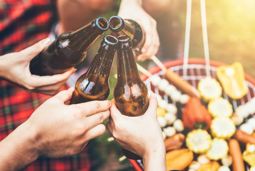 This file photo shows people drinking beer at an outdoor party. According to Cape Breton Regional Police Chief Peter McIsaac, warmer weather and high school graduations means more parties with large numbers of teens, often drinking alcohol.
