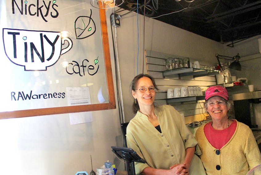 Nicky Duenkel, left, and her partner, Judy Pratt, are pictured inside their new plant-based establishment Nicky’s Tiny Cafe located behind Escape Outdoors on Commercial Street.