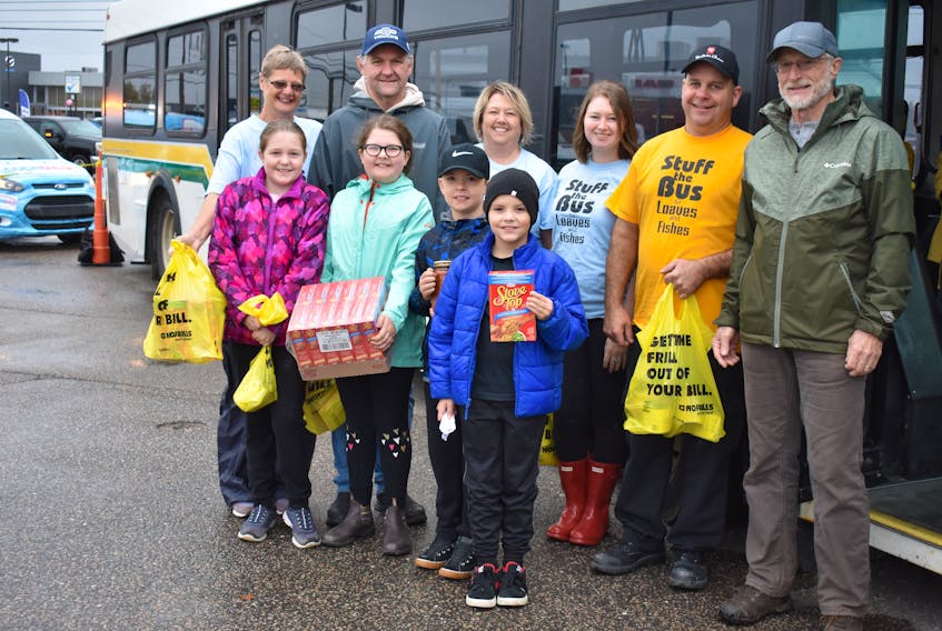 Colbourne's No Frills, on Welton Street in Sydney, held their fourth annual Stuff the Bus fundraiser for Loaves and Fishes community kitchen and food bank on Oct. 12. Pictured here are: (back row, from left) Marguerite MacDonald, Marco Amati, Karen Colbourne, Ashley Colbourne, Troy Ferneyhough, Lloyd Tallman, (front row, from left) Sara Black, Maddison MacDonald, Colton MacDonald and Jackson Lundrigan.