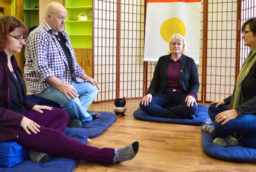 Some of the members of the Sydney Shambhala Meditation group Miriam Saloh, from left, Kenny McGillivray, Catherine Moir and Jean Eyking meditate together. The group, which is part of an international community of meditation centres based on Buddhist philosophy, invites the public to an open house in room 205 at New Dawn Centre fort Social Innovation on Nepean Street in Sydney on Tuesday.