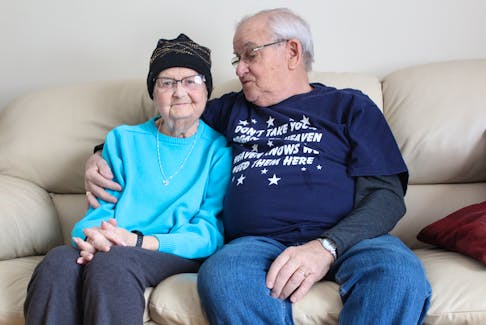 Lois and Adam Lewis sit on the couch at their southend Sydney home. Having undergone surgery in August 2001, Lois is considered the longest living lung transplant recipient in Nova Scotia.