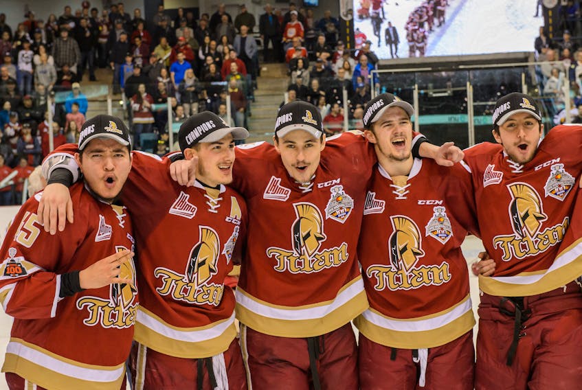 Mitchell Balmas of Sydney, centre, is shown with Acadie-Bathurst Titan teammates after defeating the Blainville-Boisbriand Armada 2-1 on Sunday in Bathurst, N.B. With the victory, the Titan captured the best-of-seven Quebec Major Junior Hockey League championship series, 4-2.