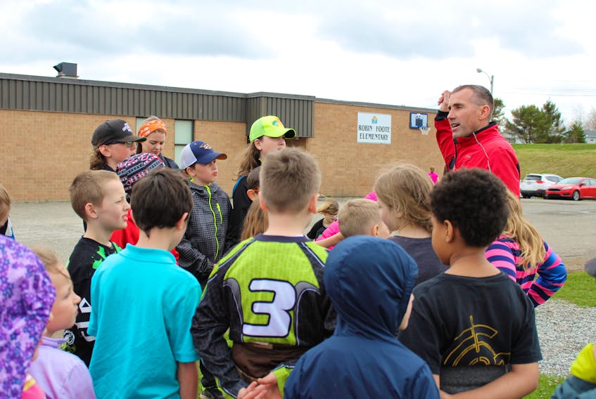 Robin Foote Elementary principal Stephen MacDougall gives members of the school’s Kids’ Run Club some guidance as they headed out for a run Friday. The club runs three times a week and is preparing for the upcoming Fiddlers’ Run.