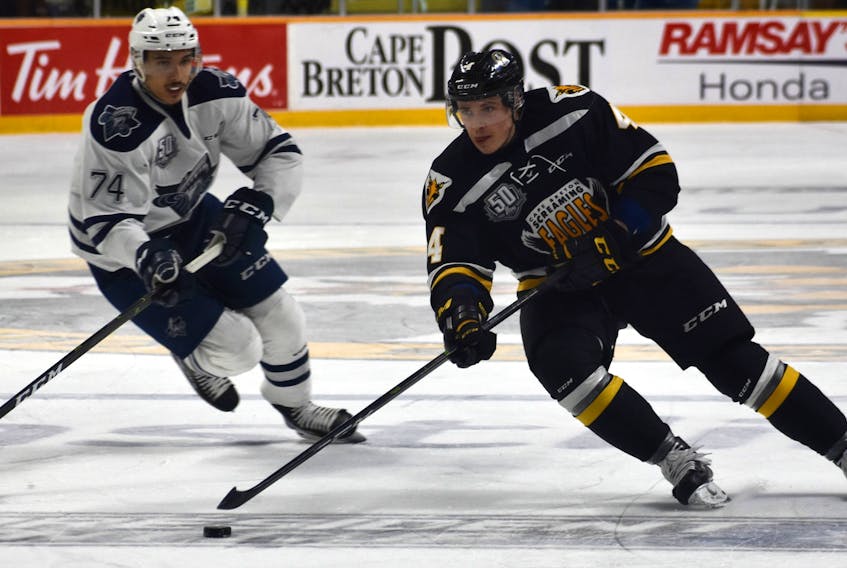 In this file photo, Nathan Larose of the Cape Breton Eagles, right, looks towards the net during last year’s Quebec Major Junior Hockey League second-round President Cup series with the Rimouski Océanic. Larose is one of five veteran defencemen on the team’s training camp roster. Training camp opens Friday.