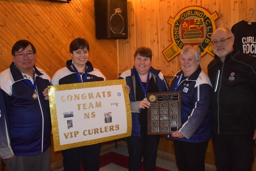 Team Nova Scotia captured its first-ever Canadian Visually Impaired Curling Championship on Feb. 8. The team, skipped by Louise Gillis, defeated Ontario 8-1 in the championship game. Team members, from left, Sidney Francis (coach/guide), Terrylynn MacDonald, Mary Campbell, Gillis, and Garth Nathanson (coach/guide).